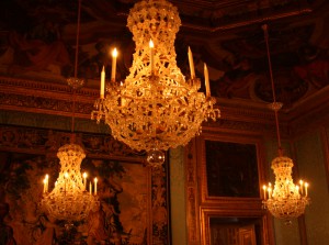 The most impressive way to light a room is by crystal chandeliers. The candlelight is reflected and refracted by thousands of crystal pieces. As it takes many chandeliers and candles to create the festive effect you see on the photo, brightness was only for the rich. Upon entering a room ablaze with the light of crystal chandeliers, one looks inevitably up towards the light, at the same time taking in the grandeur of the chandelier and the ornate ceiling.