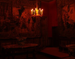 2. In rooms lit only by a few candles, dark shadows are lurking everywhere. It takes the eye several moments to adjust to the level of light of each room and to see who and what is inside.