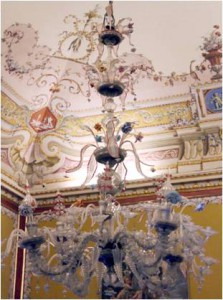 Delicate Murano glass-chandeliers light the frescoed rooms